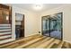 Bedroom with wood-look vinyl flooring and sliding glass doors to a screened-in porch at 2757 Shelley Ln, Ellenwood, GA 30294