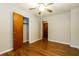 Bedroom featuring hardwood floors, closet, and natural light at 2757 Shelley Ln, Ellenwood, GA 30294