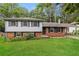 Inviting home exterior featuring a manicured lawn and classic brick facade at 2757 Shelley Ln, Ellenwood, GA 30294