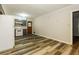 Kitchen featuring vinyl flooring, neutral cabinetry, and white appliances at 2757 Shelley Ln, Ellenwood, GA 30294