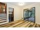 Bright living room with wood-look floors and sliding glass doors to screened-in porch at 2757 Shelley Ln, Ellenwood, GA 30294