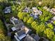 An aerial view of a beautiful neighborhood with mature trees and well-maintained homes at 5160 Pratt Sw St, Covington, GA 30014