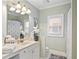 Cozy bathroom with bright neutral paint, shower/tub, and natural light at 5160 Pratt Sw St, Covington, GA 30014