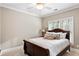 Comfortable bedroom with plush carpet, bright window, and a full-sized bed at 5160 Pratt Sw St, Covington, GA 30014