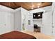 Bedroom featuring wood ceiling and adjacent bathroom with built-in desk at 5160 Pratt Sw St, Covington, GA 30014