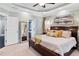 A light-filled main bedroom featuring a tray ceiling and generous Primary bed at 5160 Pratt Sw St, Covington, GA 30014