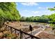 Expansive community garden with raised beds and a variety of plants and flowers at 5160 Pratt Sw St, Covington, GA 30014
