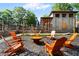 Cozy outdoor fire pit area with Adirondack chairs, perfect for relaxing and socializing at 5160 Pratt Sw St, Covington, GA 30014