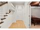 Welcoming hallway featuring a staircase and entry to a cozy bedroom at 5160 Pratt Sw St, Covington, GA 30014