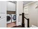 Convenient laundry room on the upper level with a full-sized washer and dryer set at 5160 Pratt Sw St, Covington, GA 30014