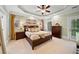 Spacious bedroom features tray ceilings, a king-size bed, and abundant natural light at 5160 Pratt Sw St, Covington, GA 30014