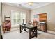 Charming office space with natural light, vintage decor, and wood desk at 5160 Pratt Sw St, Covington, GA 30014
