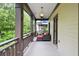 Inviting covered porch with star pendant and comfy lounge seating at 5160 Pratt Sw St, Covington, GA 30014