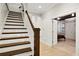 Beautifully crafted staircase with white risers and natural wood treads at 5160 Pratt Sw St, Covington, GA 30014