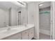 Bright bathroom showcasing a double sink vanity and a separate shower at 5435 Vicarage Walk, Alpharetta, GA 30005