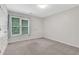 Cozy bedroom featuring a window providing natural light at 5435 Vicarage Walk, Alpharetta, GA 30005