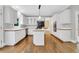 Kitchen features stainless steel appliances, an island cooktop, and lots of cabinets at 5435 Vicarage Walk, Alpharetta, GA 30005