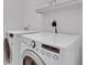 Laundry room featuring a modern washer and dryer at 5435 Vicarage Walk, Alpharetta, GA 30005
