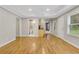 Open-concept living area with a view of the kitchen and bathroom at 5435 Vicarage Walk, Alpharetta, GA 30005