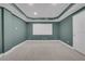 The living room boasts recessed lighting, a projection screen, and neutral carpet flooring at 5435 Vicarage Walk, Alpharetta, GA 30005