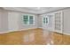 Spacious living room with hardwood floors and natural light at 5435 Vicarage Walk, Alpharetta, GA 30005
