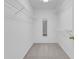 Walk-in closet with wire shelving and neutral carpet at 5435 Vicarage Walk, Alpharetta, GA 30005
