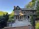 Back exterior featuring a large deck with seating, and mature trees at 990 Azalea Dr, Roswell, GA 30075