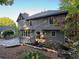 Back exterior of a home showcasing gray siding, large windows, and a spacious wooden deck at 990 Azalea Dr, Roswell, GA 30075