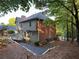 Beautiful backyard with multi-level deck and wooded surroundings of the property at 990 Azalea Dr, Roswell, GA 30075