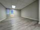 Finished basement featuring a door to the exterior and wood-look floors at 990 Azalea Dr, Roswell, GA 30075