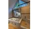 Modern bathroom featuring a soaking tub, glass enclosed shower and a large picture window at 990 Azalea Dr, Roswell, GA 30075