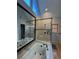 Modern bathroom with a soaking tub, glass shower, and a vanity with sink at 990 Azalea Dr, Roswell, GA 30075
