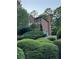 Beautiful brick home with a two car garage and mature landscaping at 990 Azalea Dr, Roswell, GA 30075