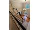 Two-story foyer with hardwood floors, chandelier, and decorative windows at 990 Azalea Dr, Roswell, GA 30075
