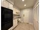 Efficient kitchen space with built-in desk, appliances, and ample cabinet storage at 990 Azalea Dr, Roswell, GA 30075