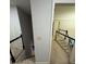 Carpeted stairway featuring white railings and a view of the upstairs hallway at 990 Azalea Dr, Roswell, GA 30075