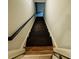 Dark wood stairs leading to the lower level at 990 Azalea Dr, Roswell, GA 30075