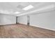 Large basement area featuring gray flooring, white walls, and access to additional rooms at 6307 Thornhedge Dr, Riverdale, GA 30296