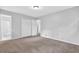 Bedroom with neutral carpet, closet, and access to en suite bathroom at 6307 Thornhedge Dr, Riverdale, GA 30296