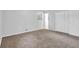 Bedroom with neutral carpet, closet, and natural light from window at 6307 Thornhedge Dr, Riverdale, GA 30296