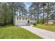 Charming two-story home featuring a classic brick facade, attached garage, and a well-maintained front yard at 6307 Thornhedge Dr, Riverdale, GA 30296