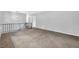 Bright living room featuring neutral paint, cozy carpet, and large windows offering ample natural light at 6307 Thornhedge Dr, Riverdale, GA 30296