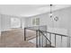 Bright living room featuring neutral paint, cozy carpet, and large windows offering ample natural light at 6307 Thornhedge Dr, Riverdale, GA 30296