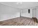 Large living room featuring hardwood floors and neutral paint at 6307 Thornhedge Dr, Riverdale, GA 30296