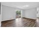 Living room features hardwood floors and sliding glass doors to outdoor deck at 6307 Thornhedge Dr, Riverdale, GA 30296