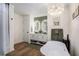 Modern bathroom with double vanity, sleek mirrors, soaking tub, and stylish chandelier at 801 Sugar Creek Se Trl, Conyers, GA 30094