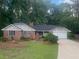 Charming brick home with a well-manicured lawn and mature trees in a peaceful, suburban setting at 801 Sugar Creek Se Trl, Conyers, GA 30094