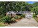 Charming brick home with a well-maintained lawn, mature landscaping, and a two-car garage at 801 Sugar Creek Se Trl, Conyers, GA 30094