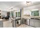 Bright kitchen with stainless steel appliances and a view of the living room at 801 Sugar Creek Se Trl, Conyers, GA 30094