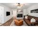 Bright living room featuring a fireplace, hardwood floors, and comfortable seating at 801 Sugar Creek Se Trl, Conyers, GA 30094